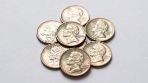 Collection of valuable state quarters with intricate designs.